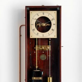 Partly skeletonised wall clock with two pendulums.