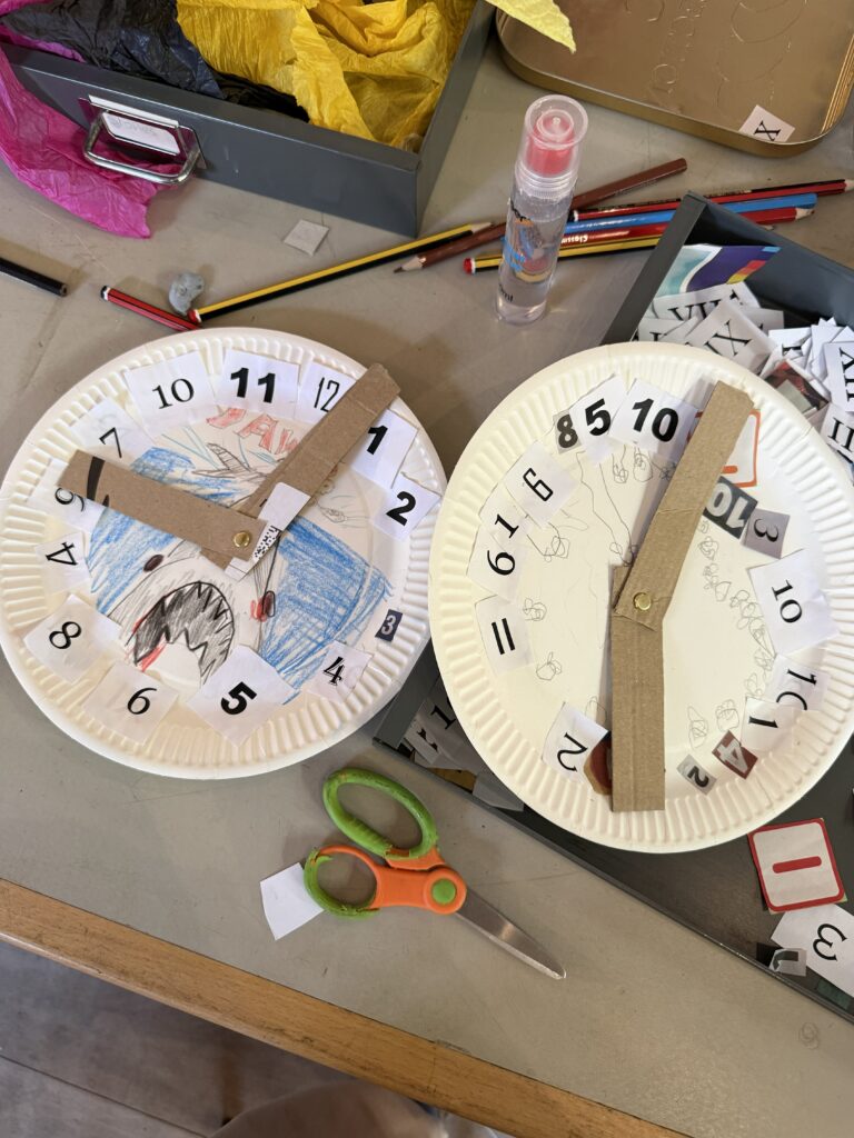 Image shows some clock dials made out of paper plates