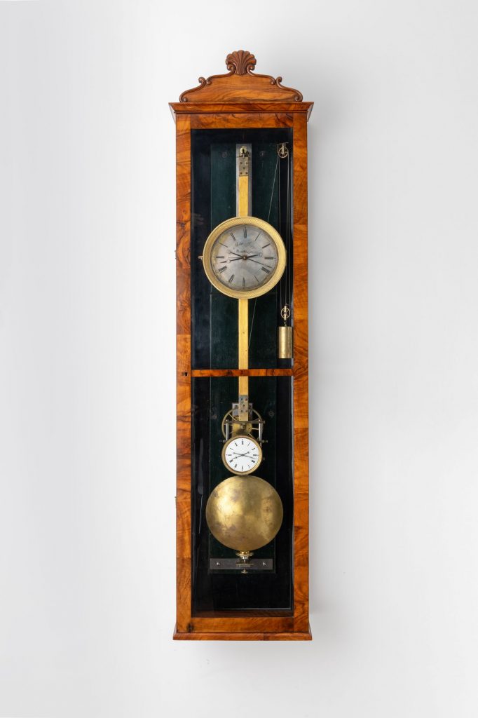 Mechanical weight-driven clock made by Matthaus Hipp, with large lenticular bob and two dials