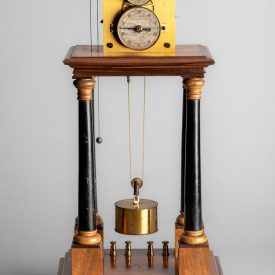 A Hipp chronoscope with a large cylindrical weight falling between four turned wooden pillars